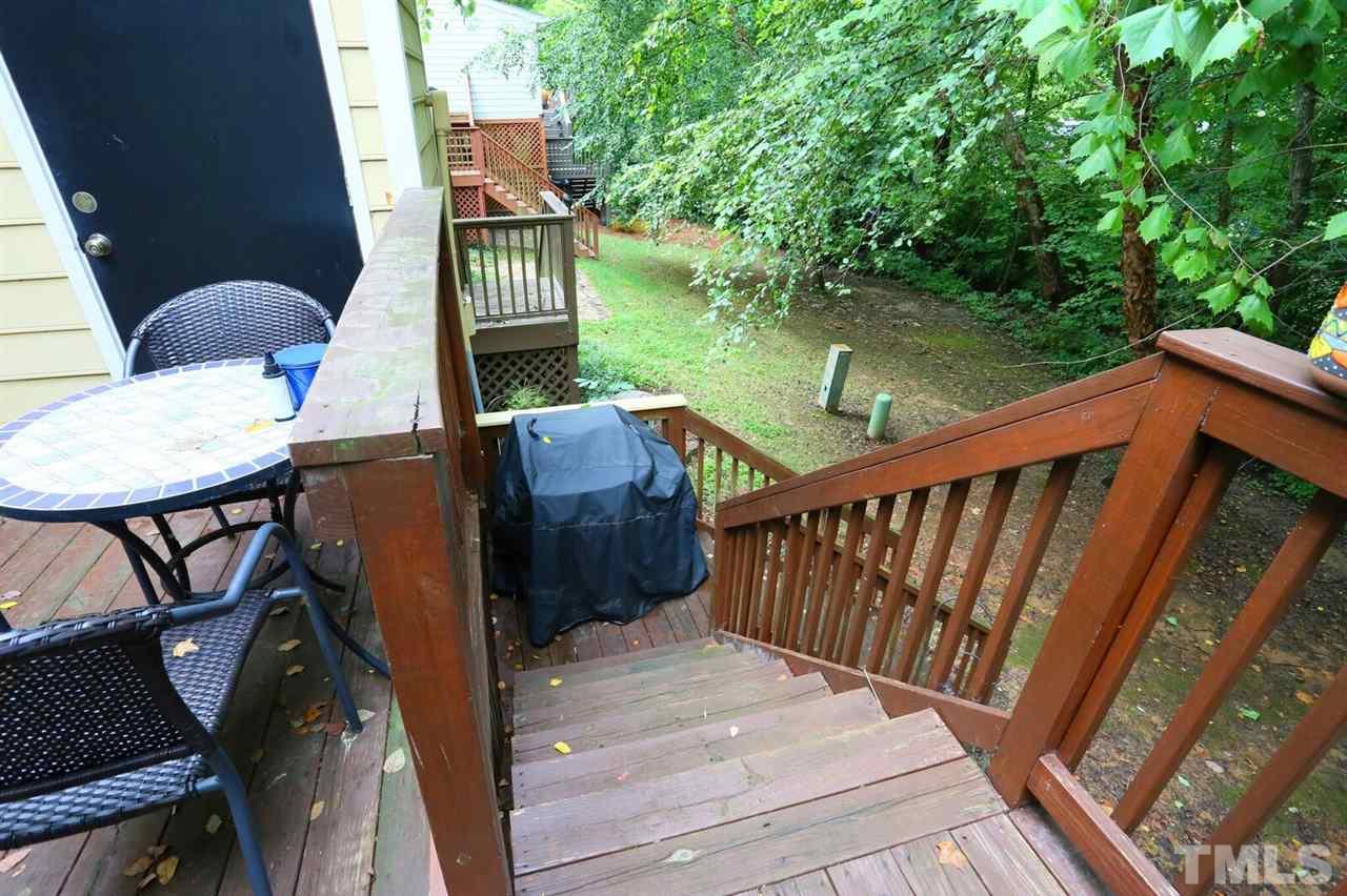 4518 Hamptonshire Drive Raleigh, NC 27613 - Photo 23 of 24 a view of a balcony with wooden floor and outdoor seating