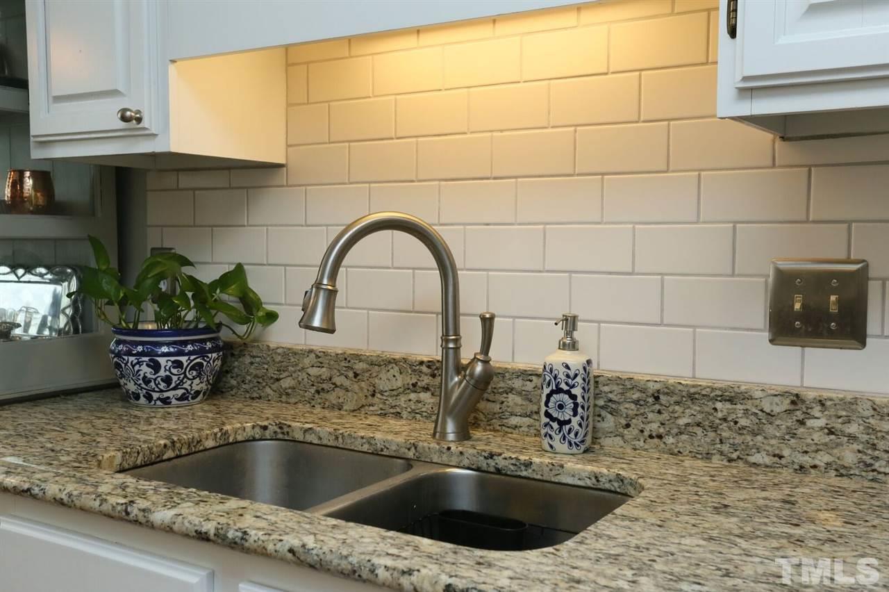 4518 Hamptonshire Drive Raleigh, NC 27613 - Photo 4 of 24 a close view of sink and tap