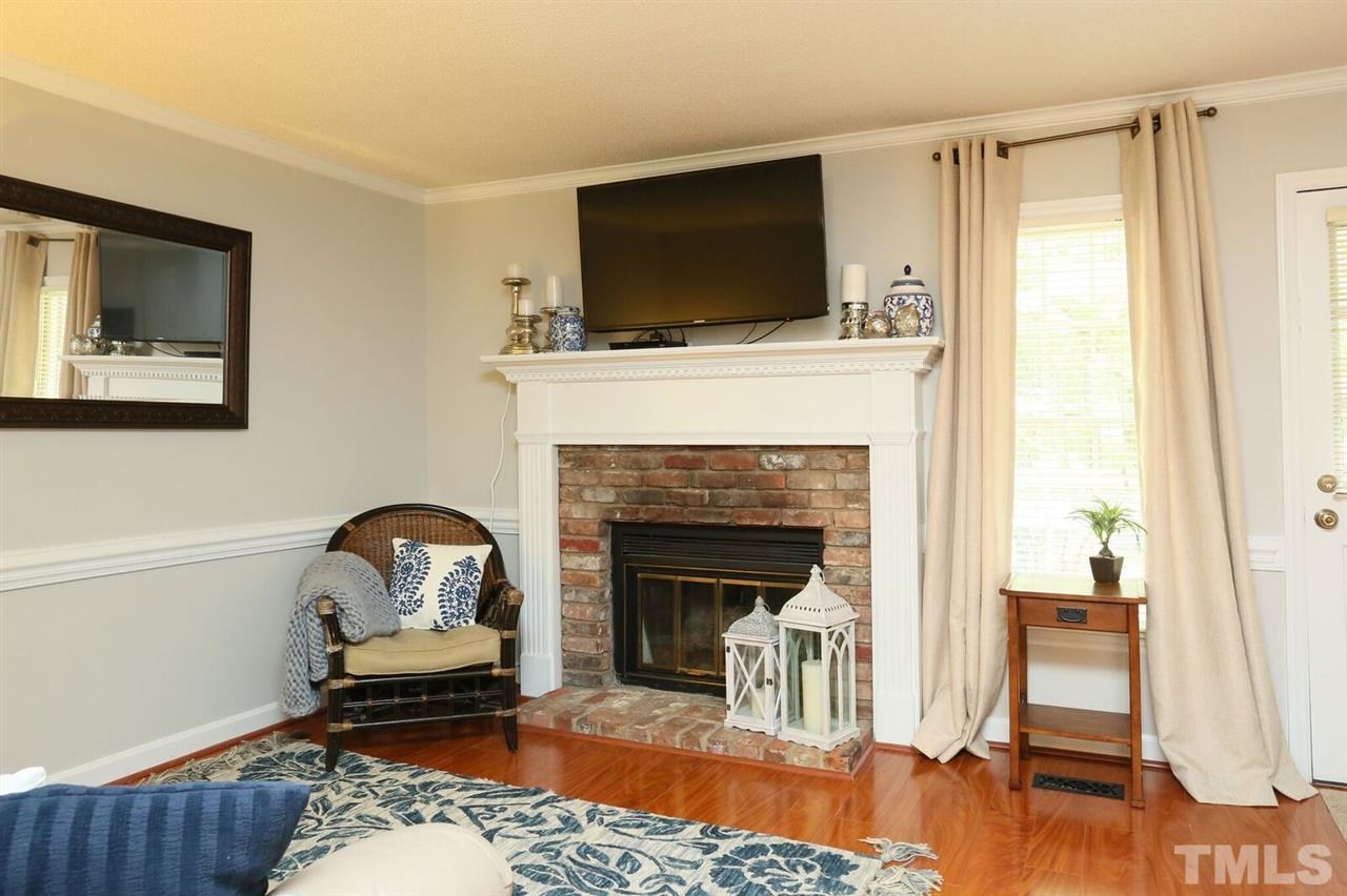 4518 Hamptonshire Drive Raleigh, NC 27613 - Photo 10 of 24 a living room with furniture and a fireplace
