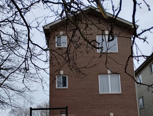 a view of a house with a large window