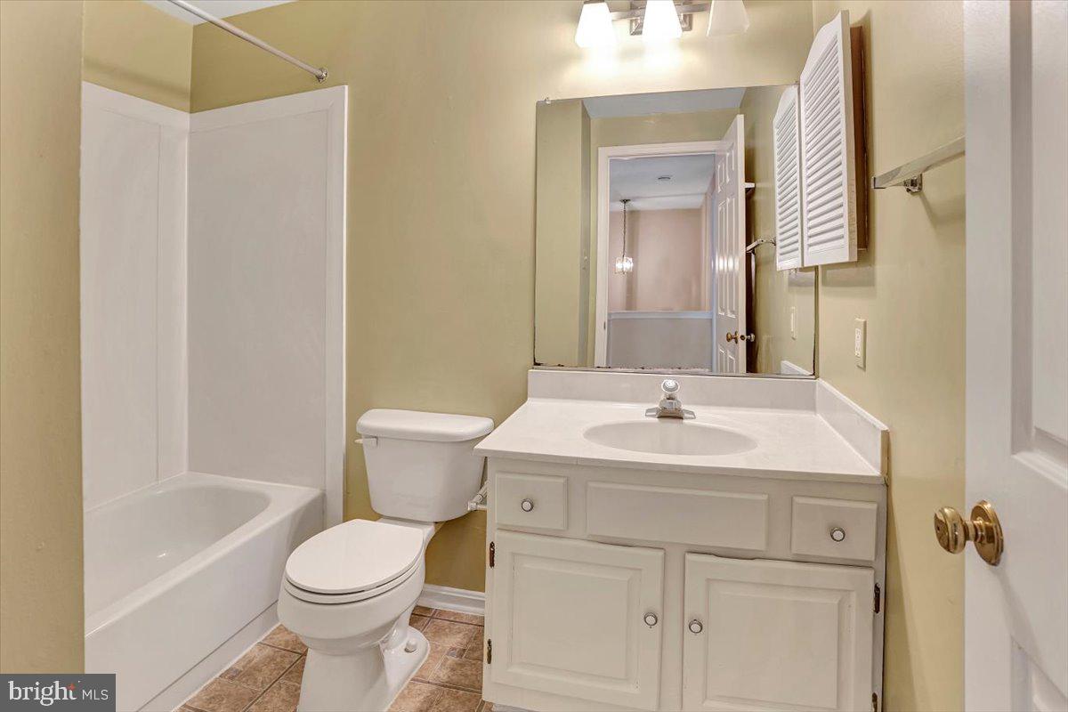 8530 London Bridge Way Lutherville-Timonium, MD 21093 - Photo 15 of 23 a bathroom with a sink a toilet and shower