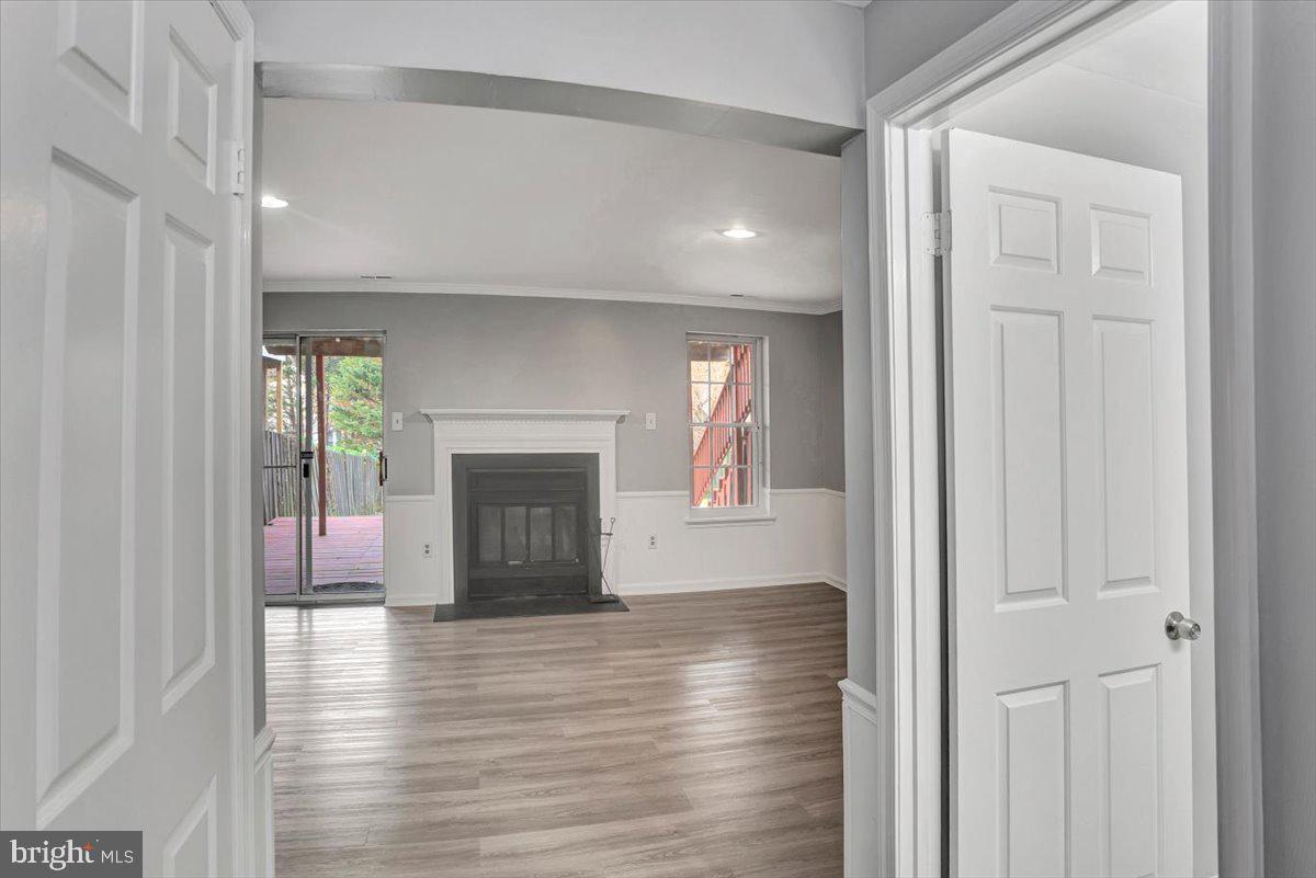8530 London Bridge Way Lutherville-Timonium, MD 21093 - Photo 17 of 23 a view of a livingroom with wooden floor and a fireplace