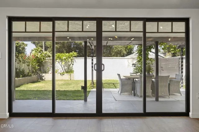 a view of a glass door and a porch