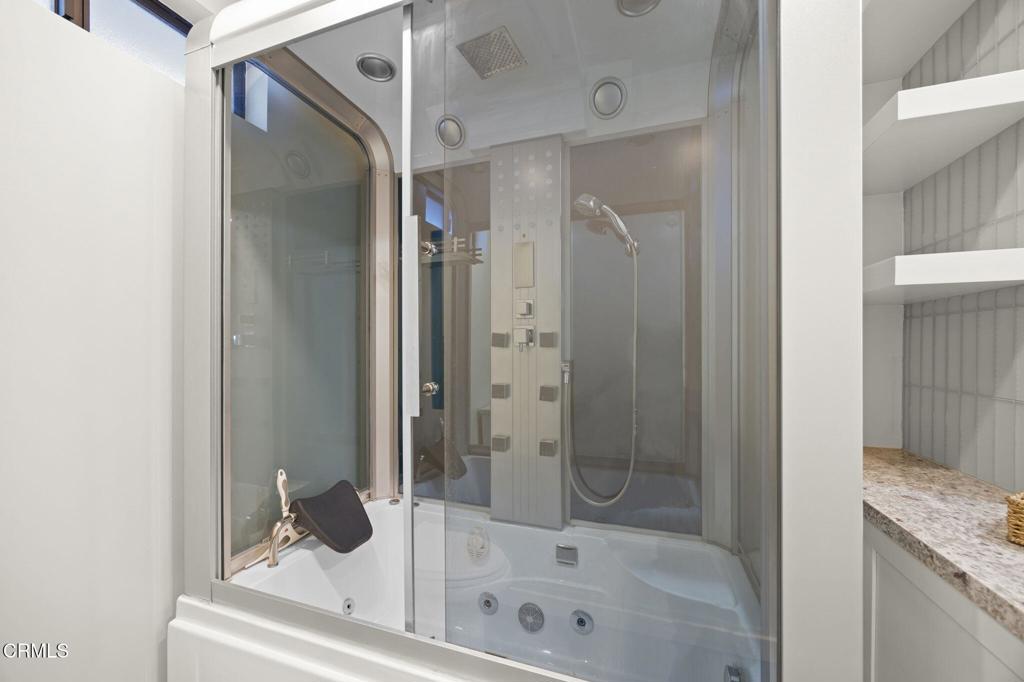 240 North Padre Juan Avenue Ojai, CA 93023 - Photo 17 of 50 a bathroom with a tub and shower