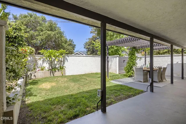 a view of a back yard from a room