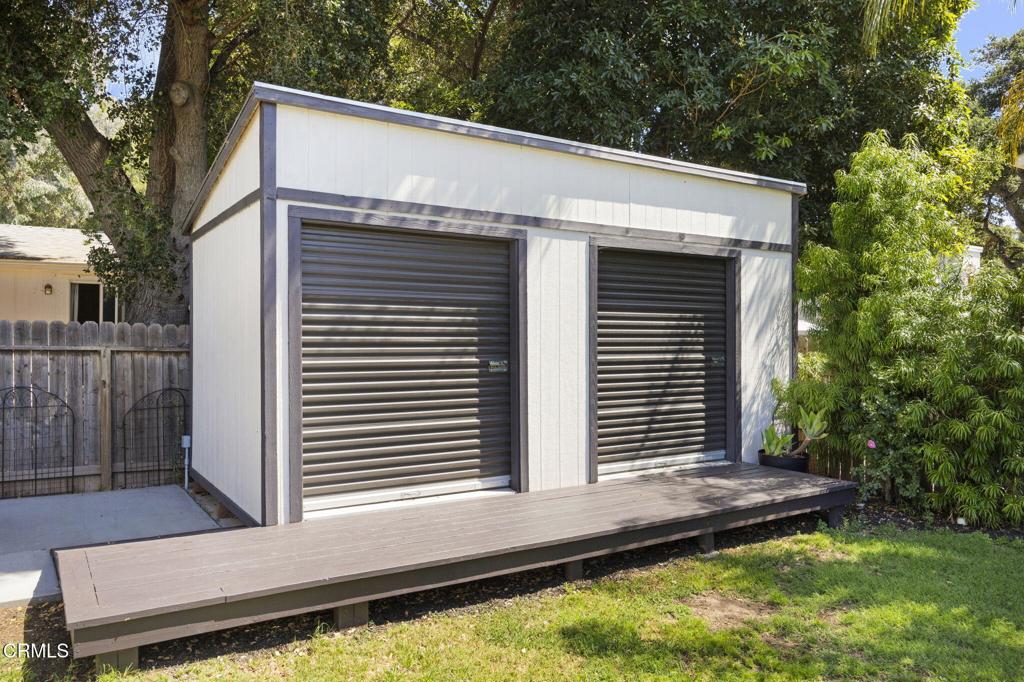 240 North Padre Juan Avenue Ojai, CA 93023 - Photo 33 of 50 a view of a white house with a large window and wooden fence