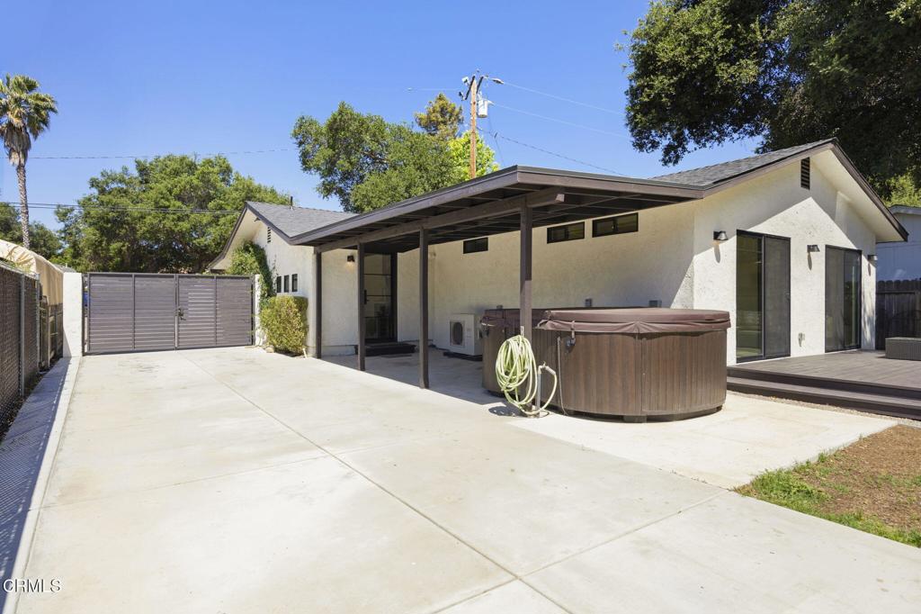 240 North Padre Juan Avenue Ojai, CA 93023 - Photo 35 of 50 a view of a house with a backyard and a garage