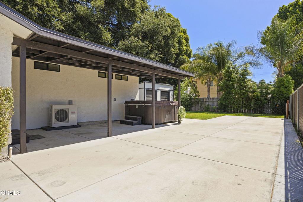 240 North Padre Juan Avenue Ojai, CA 93023 - Photo 36 of 50 a backyard of a house with large trees and outdoor seating