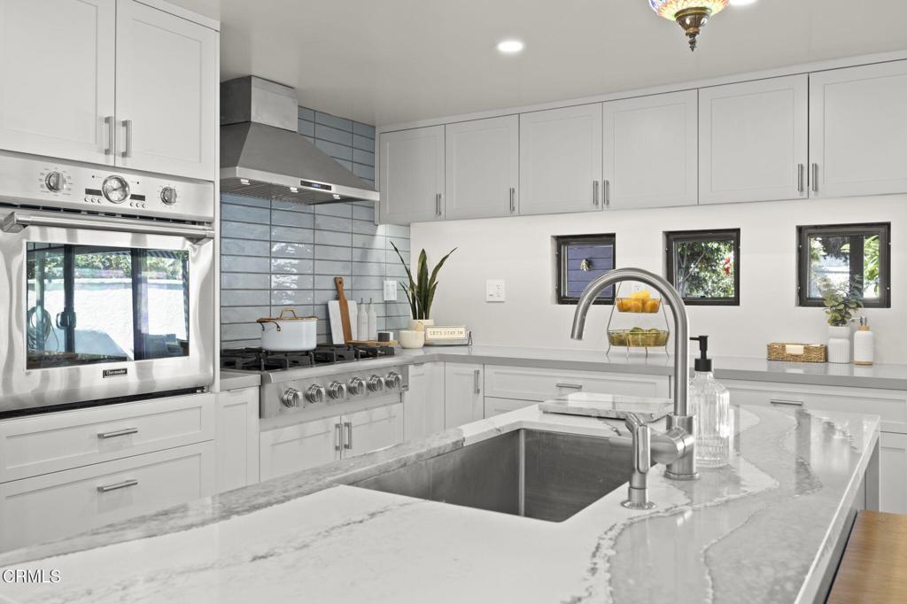 240 North Padre Juan Avenue Ojai, CA 93023 - Photo 8 of 50 a kitchen with granite countertop a sink cabinets and window