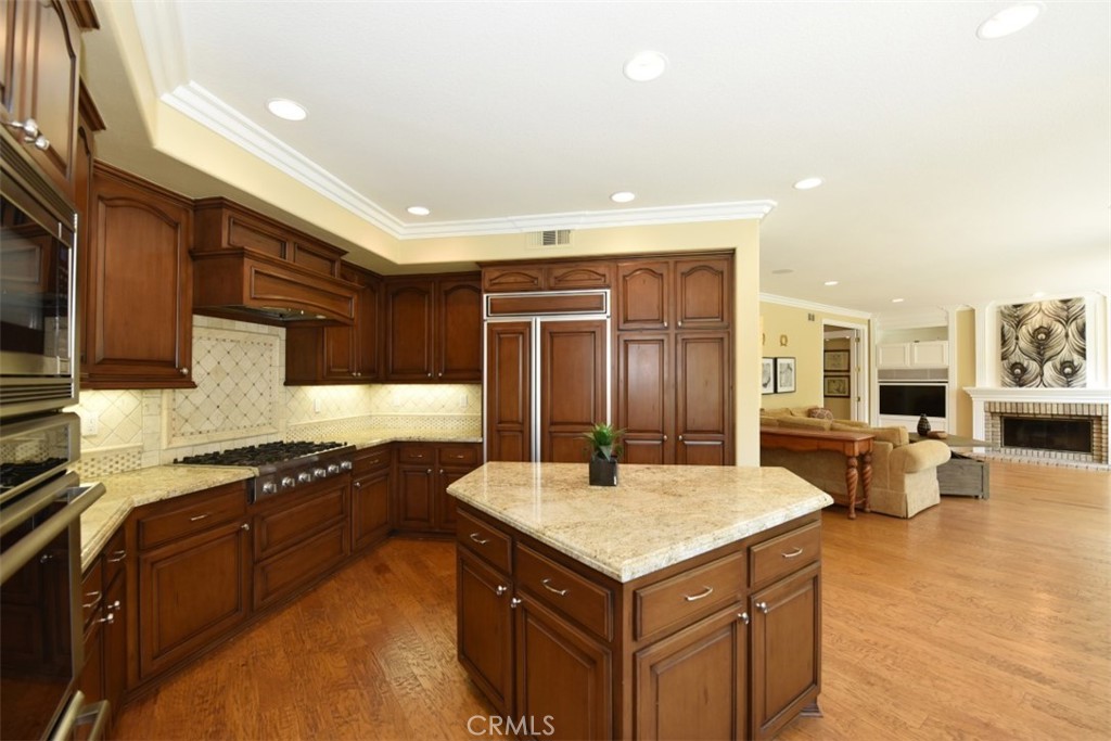 12 Brigadier Irvine, CA 92603 - Photo 10 of 50 a kitchen with stainless steel appliances granite countertop a sink and a refrigerator