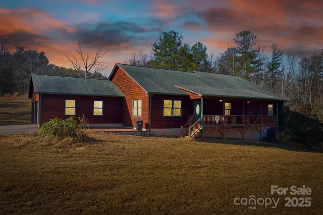a view of a house with backyard porch and sitting area
