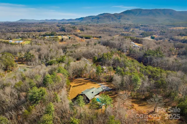an aerial view of residential house with parking space