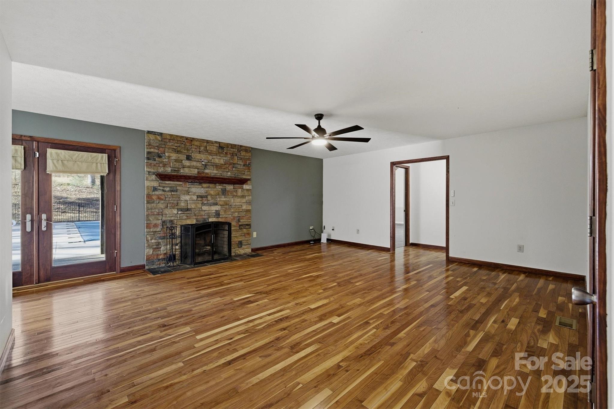 5341 Reese Store Avenue Morganton, NC 28655 - Photo 18 of 45 a view of an empty room with wooden floor fireplace and a window