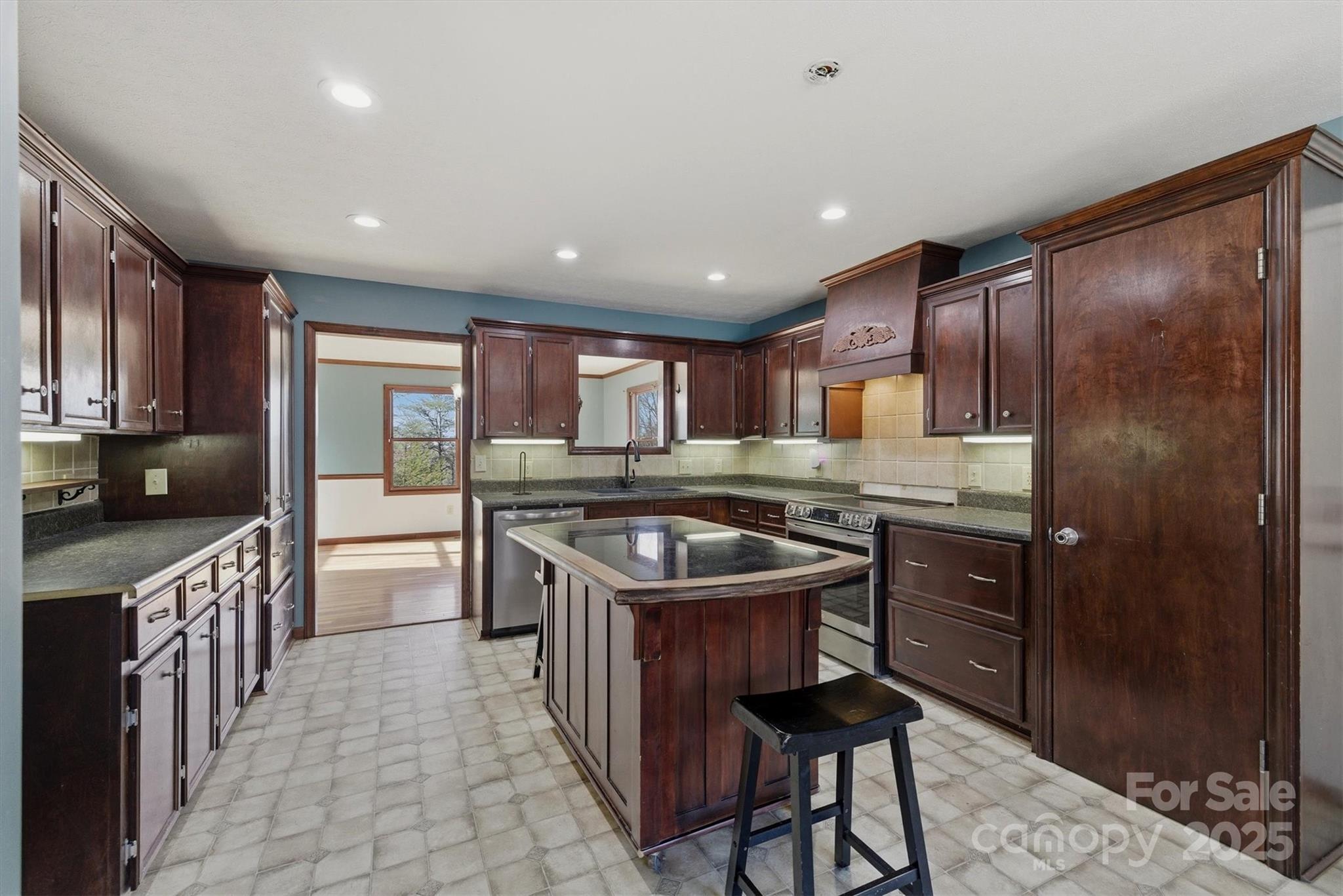 5341 Reese Store Avenue Morganton, NC 28655 - Photo 20 of 45 a kitchen with stainless steel appliances granite countertop a stove a sink and a refrigerator