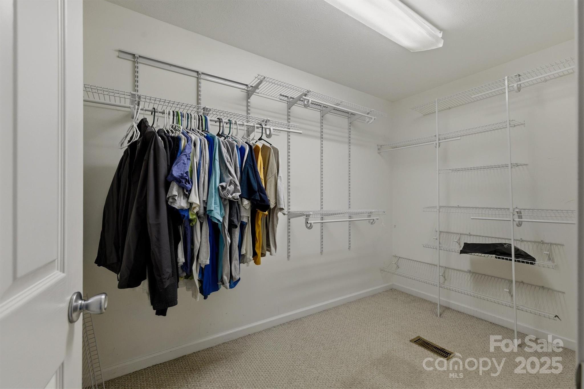 5341 Reese Store Avenue Morganton, NC 28655 - Photo 25 of 45 a view of walk in closet with clothes and shoes