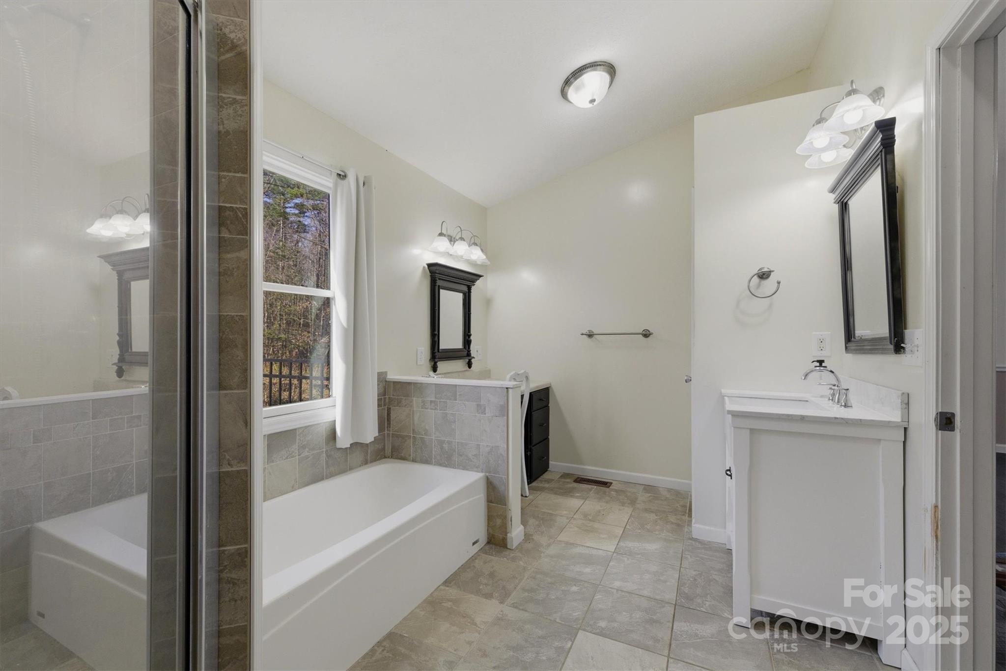 5341 Reese Store Avenue Morganton, NC 28655 - Photo 26 of 45 a bathroom with a tub a sink and a mirror