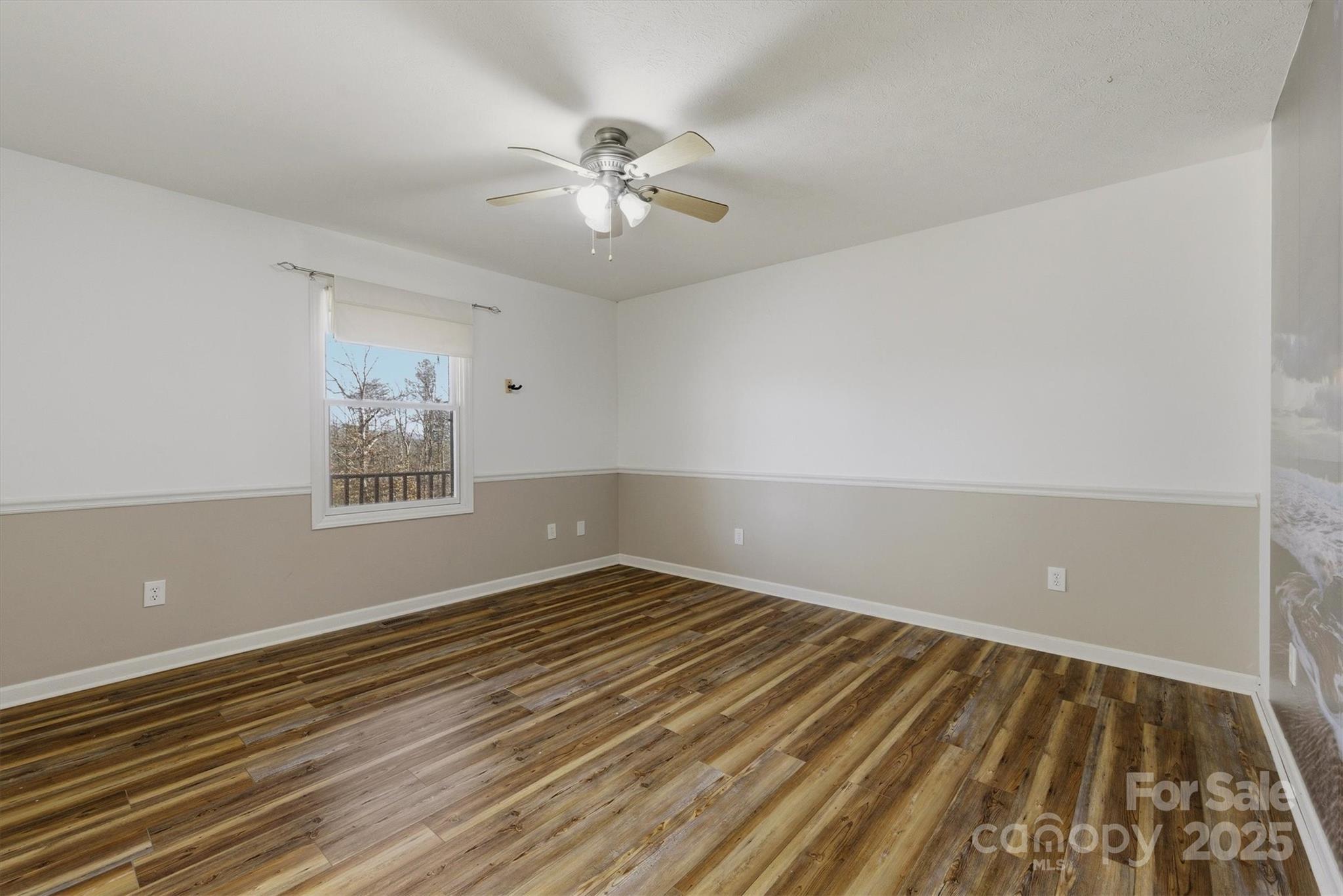 5341 Reese Store Avenue Morganton, NC 28655 - Photo 31 of 45 a view of an empty room with wooden floor and a fan
