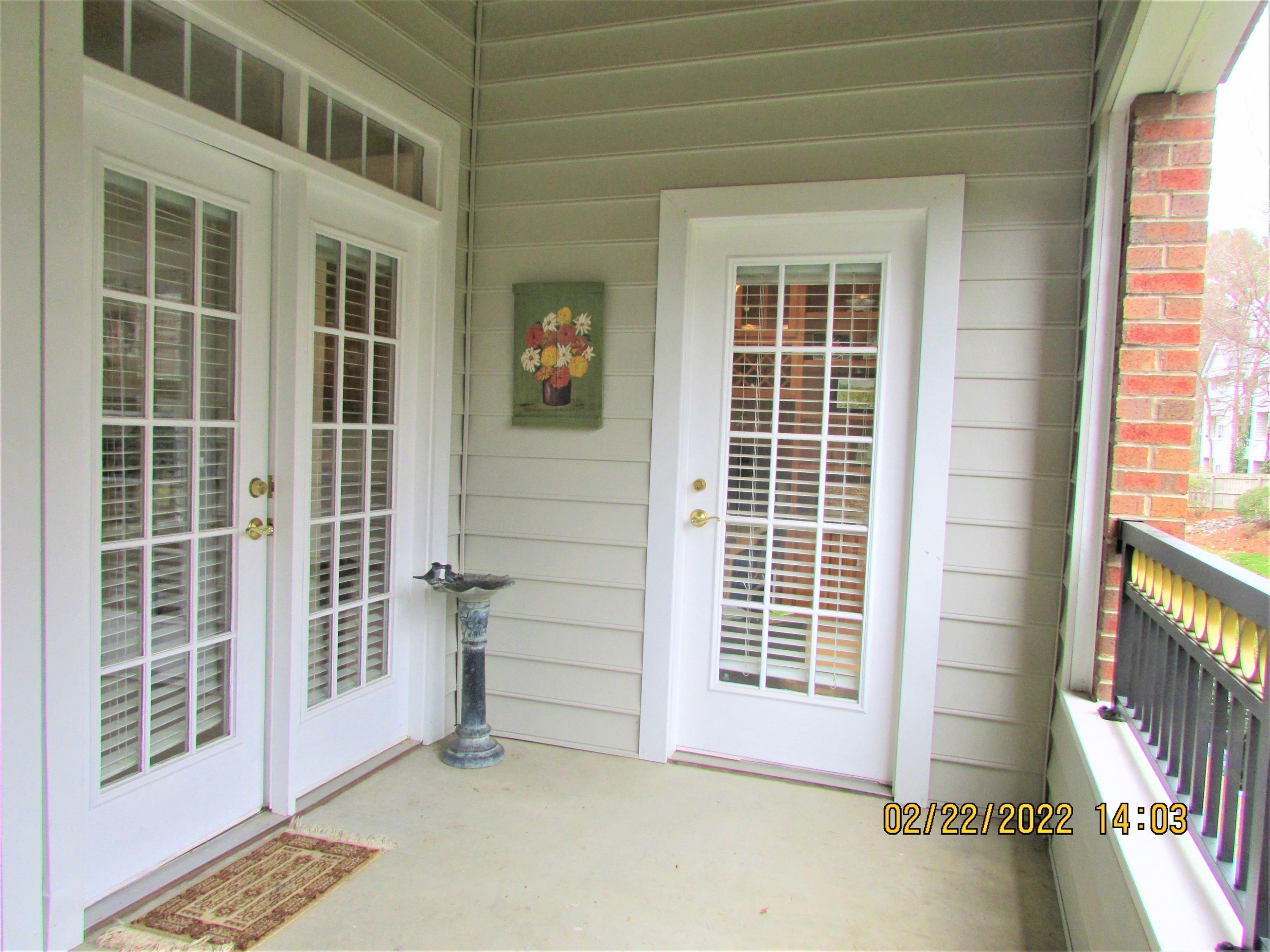 3700 Baron Cooper Pass, Unit 103 Raleigh, NC 27612 - Photo 24 of 24 Covered Porch with Access from Living Room and Breakfast Room