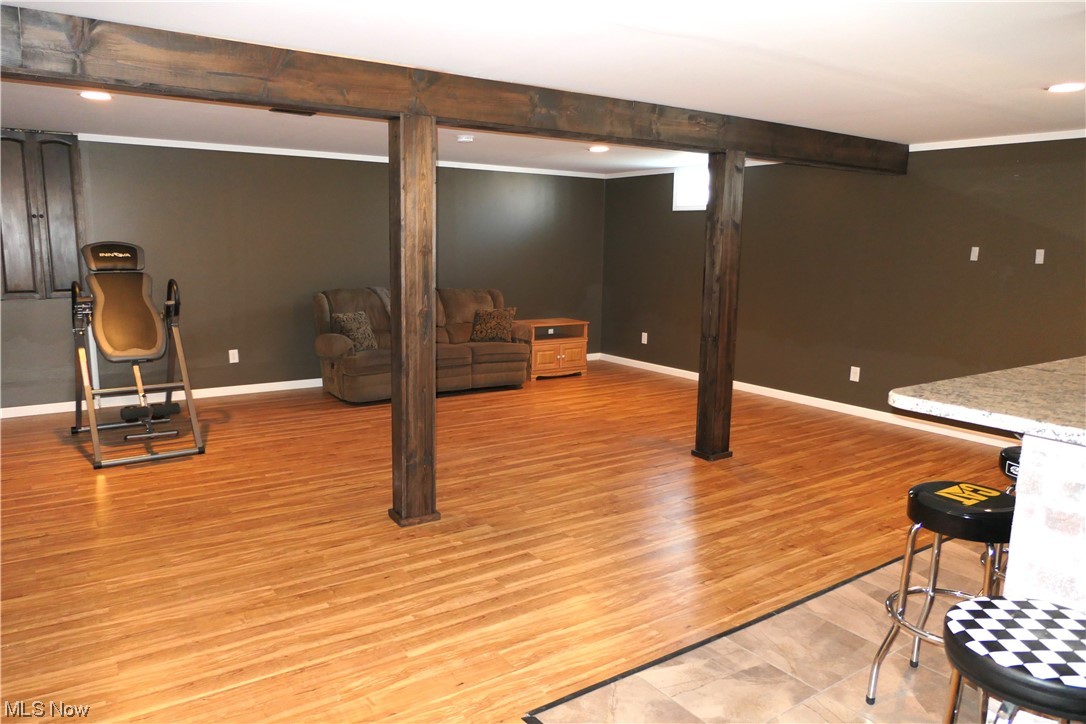 215 Home Street Rittman, OH 44270 - Photo 8 of 16 One side of the finished basement. It is HUGE and beautiful. To the right is the bar with Marble countertop.