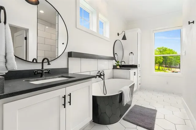 a living room with furniture and a ceiling fan