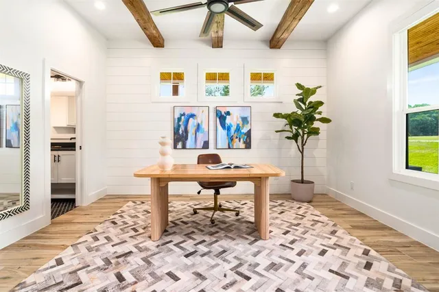 a living room with furniture fireplace and flat screen tv