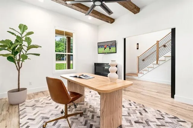 a view of a dining room with furniture a chandelier and wooden floor