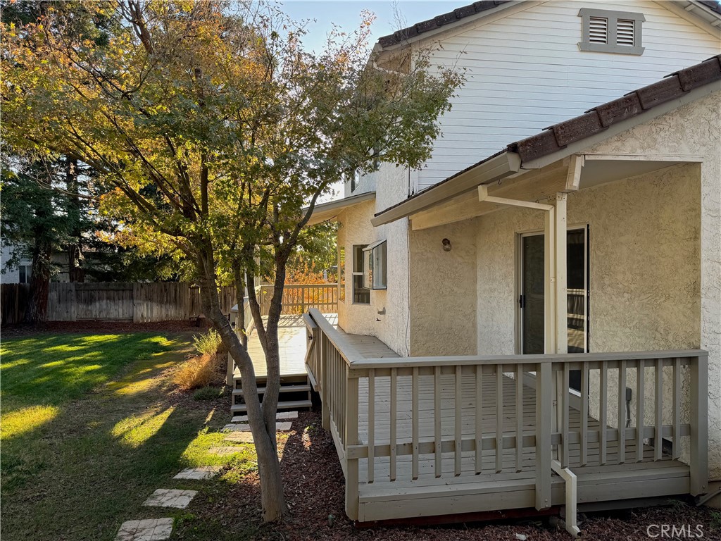 2673 Lakewest Drive Chico, CA 95928 - Photo 17 of 26 a view of a wooden deck and floor to ceiling window