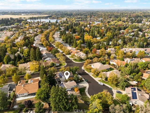 an aerial view of residential houses with outdoor space
