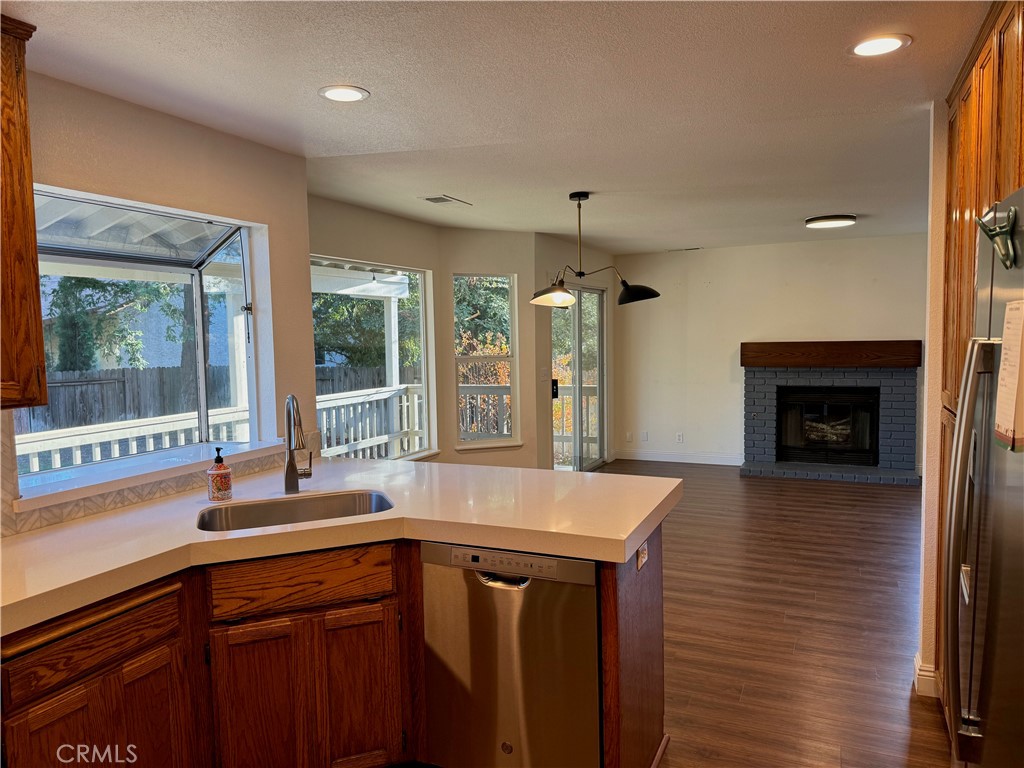 2673 Lakewest Drive Chico, CA 95928 - Photo 3 of 26 a kitchen with a sink and a fireplace
