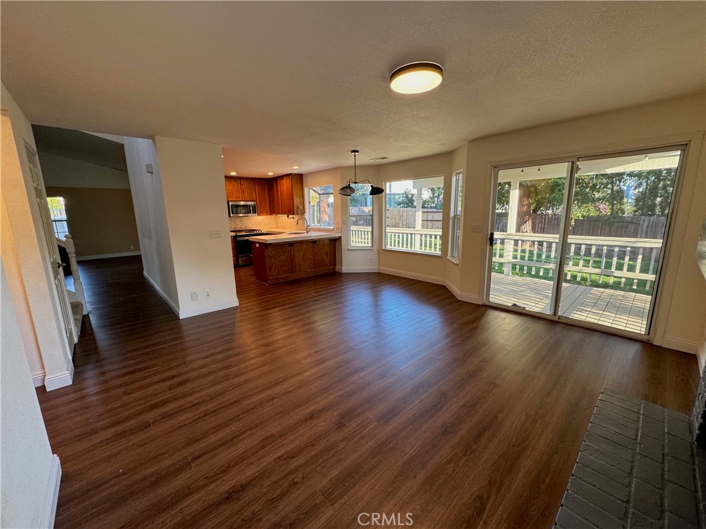 2673 Lakewest Drive Chico, CA 95928 - Photo 6 of 26 an empty room with wooden floor and windows