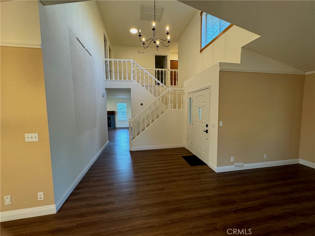 2673 Lakewest Drive Chico, CA 95928 - Photo 10 of 26 a view of a hallway with wooden floor and staircase