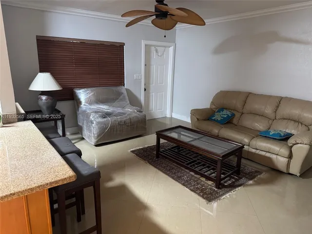 a view of a hallway with furniture