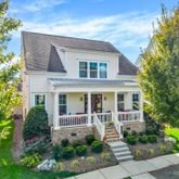 a view of house with yard