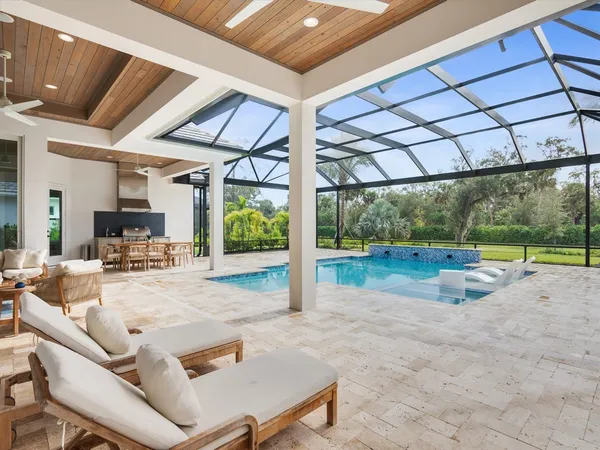 a view of a backyard with swimming pool