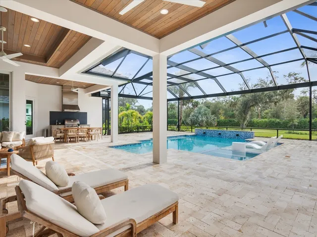 a view of a backyard with swimming pool