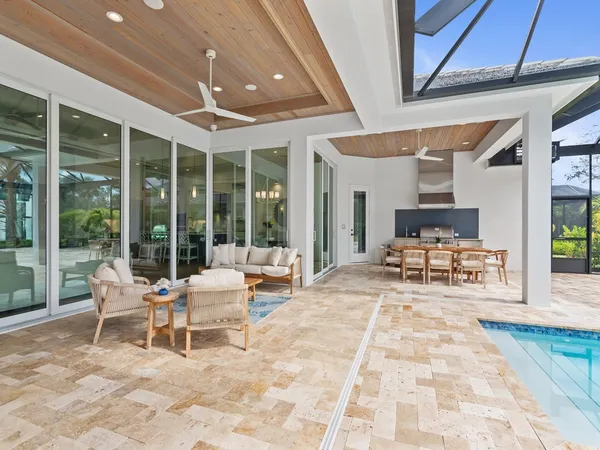 a building outdoor space with patio furniture and garden view