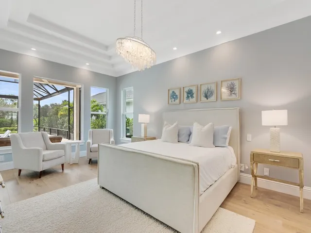 a bedroom with a large bed and a large window