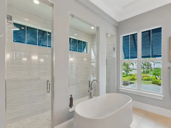 a bathroom with a bathtub and shower