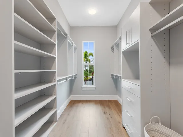 a view of bathroom with a window and toilet