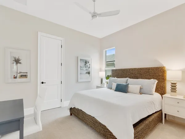 a bedroom with a bed and a night stand
