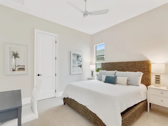 a bedroom with a bed and a night stand