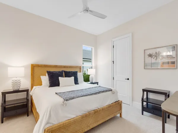 a bedroom with a bed and a chair