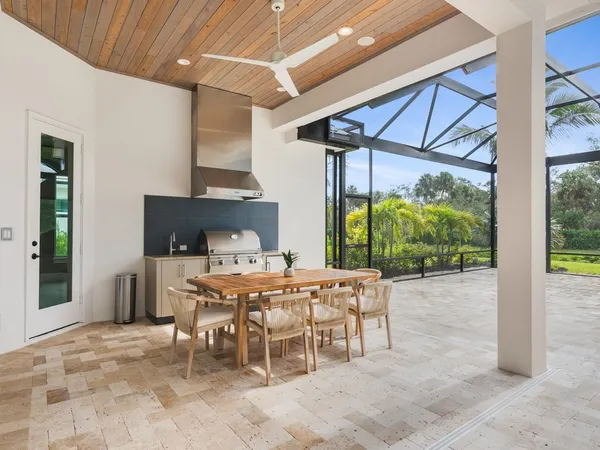 a patio with a table and chairs