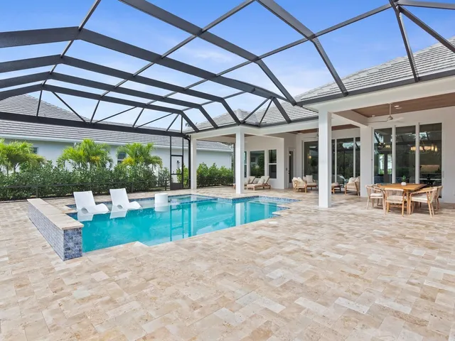 a view of swimming pool with a patio
