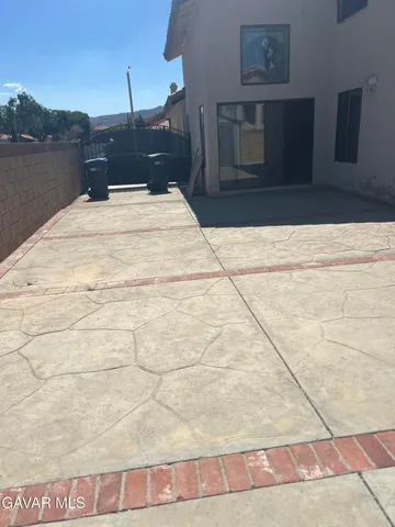 a large white bed in a small yard
