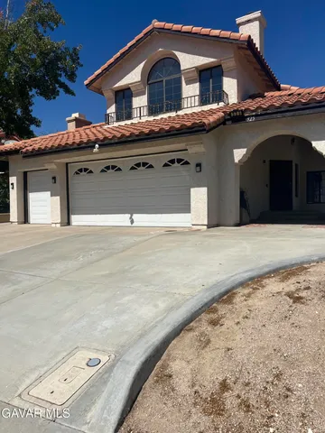 a front view of a house with a garage