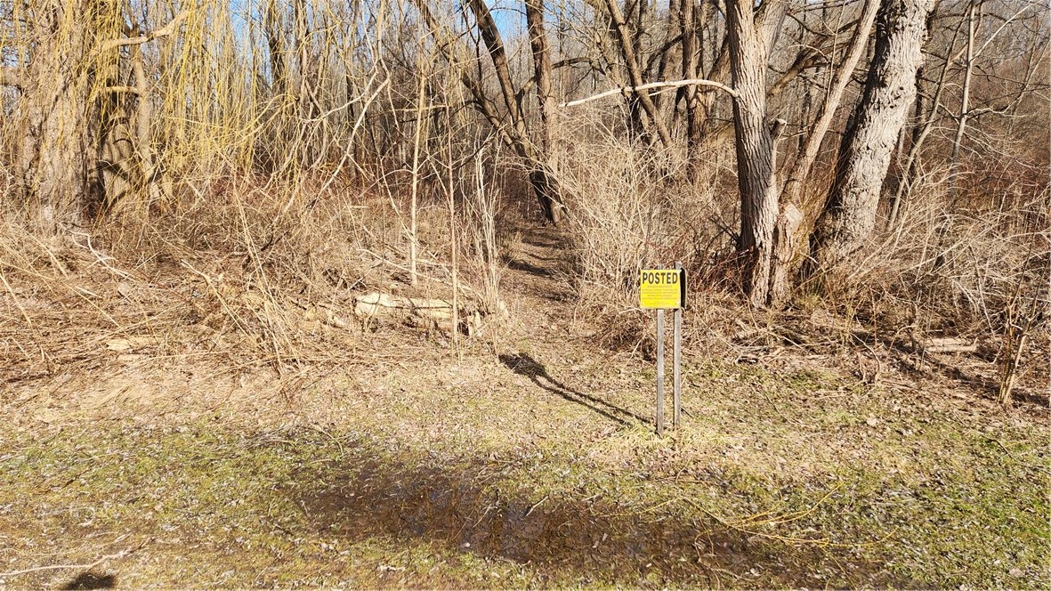 7042 Garner Road Huron, NY 14590 - Photo 2 of 12 North lot line at this posted signage of another v