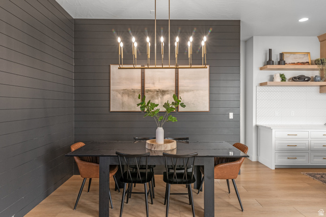 5367 Cyan Lane St. George, UT 84790 - Photo 14 of 49 Dining area featuring a linear chandelier over a dark-toned table