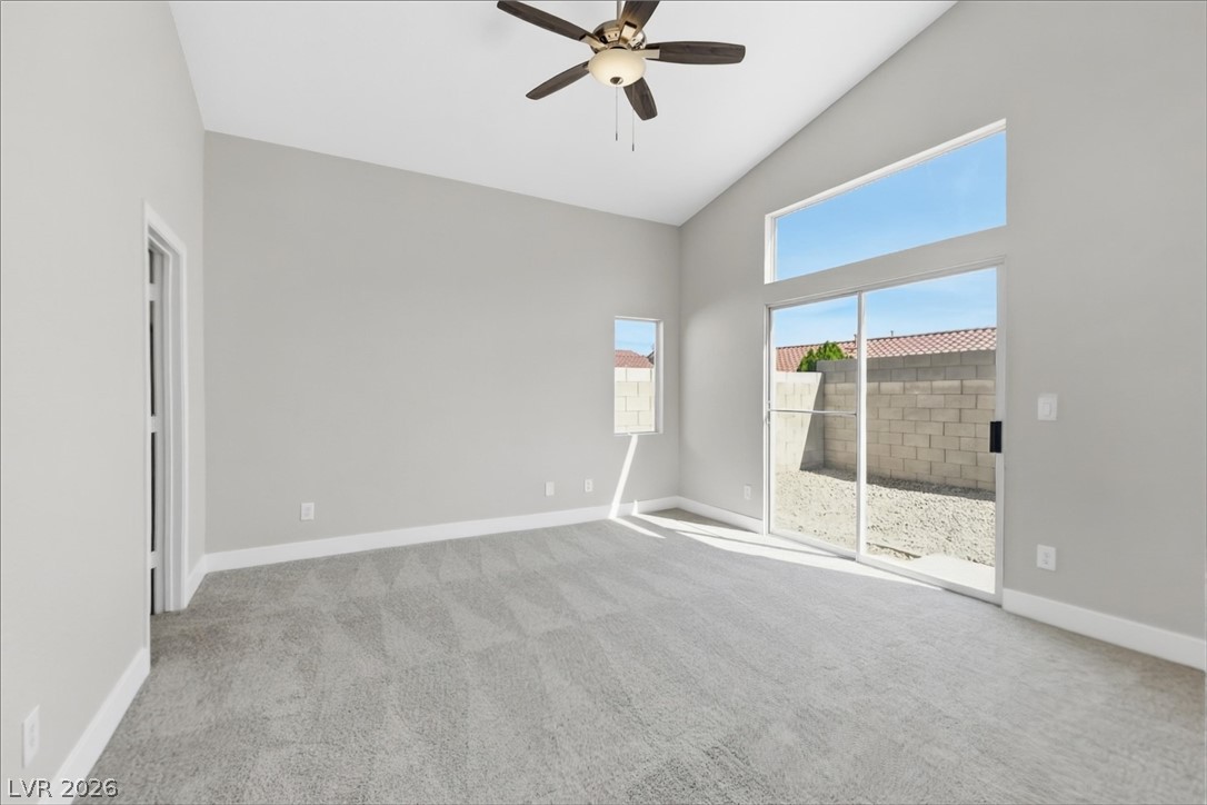 1906 Cardinal Point Street Henderson, NV 89012 - Photo 8 of 20 Vaulted ceilings and plush carpeting elevate this airy space, which connects directly to the outdoors.