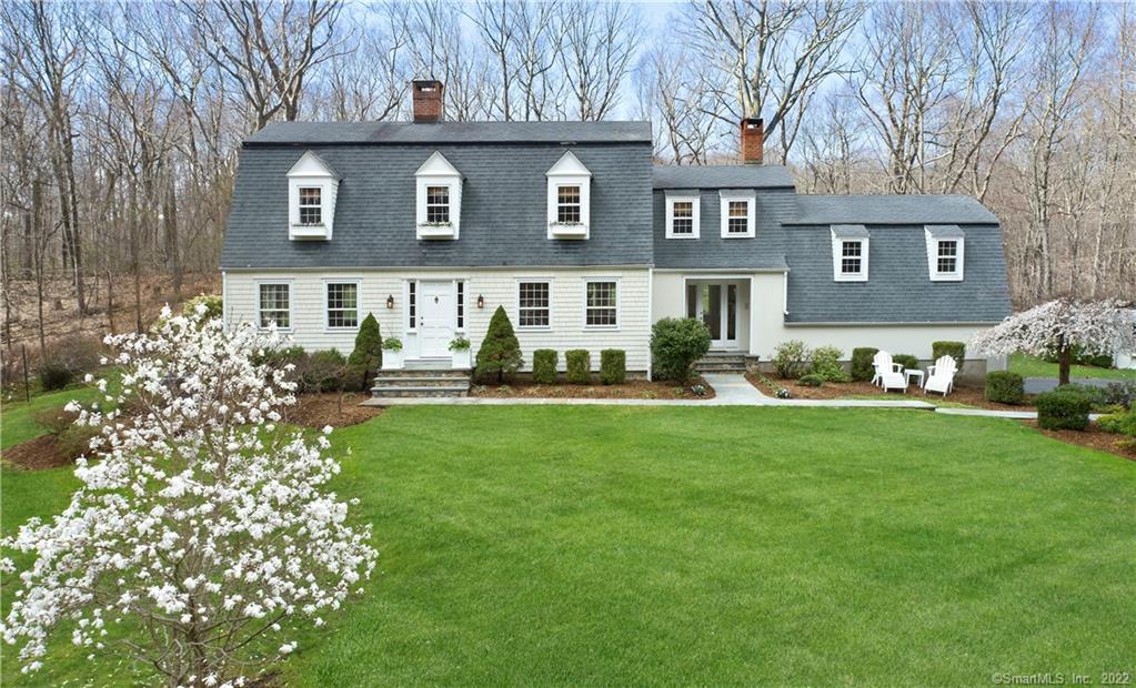 65 Bald Hill Road Wilton, CT 06897 - Photo 1 of 1 a front view of a house with garden